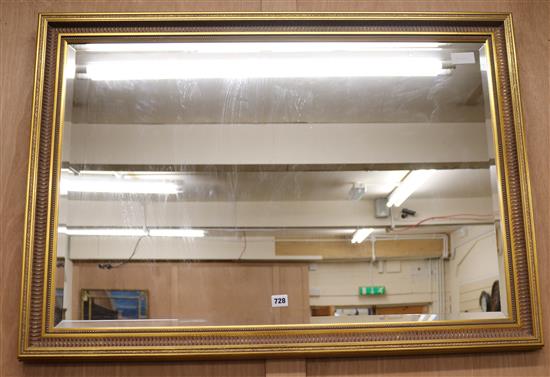A modern gilt picture frame bevelled glass wall mirror, W.103cm